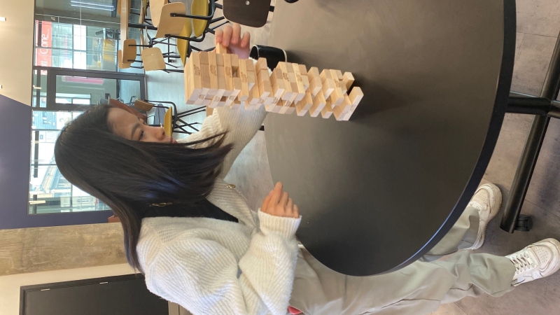 Member playing jenga