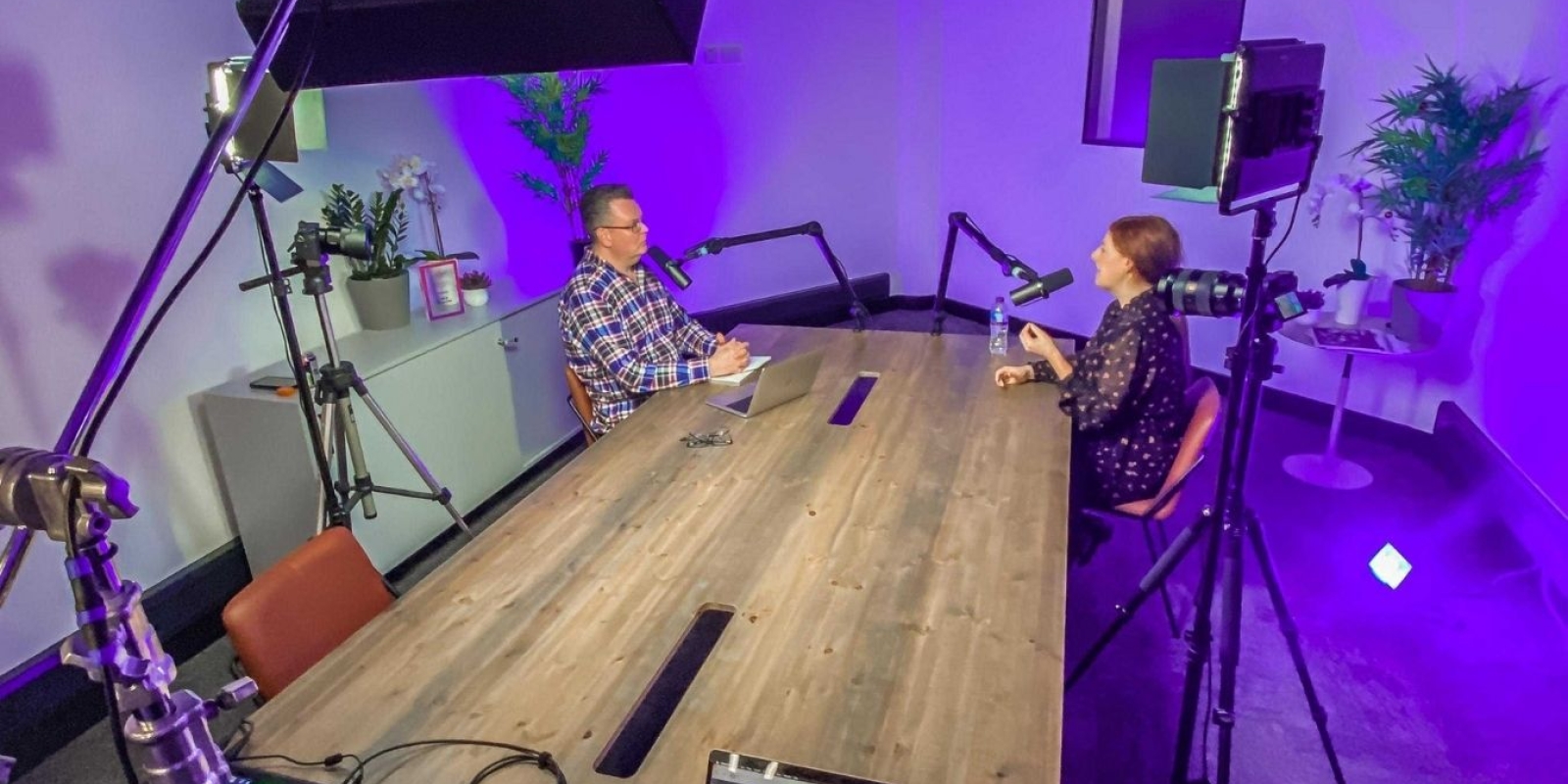 eComOne podcast room at Mosaic with recording equipment and acoustic panels